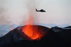 Fly over an active volcano in a helicopter